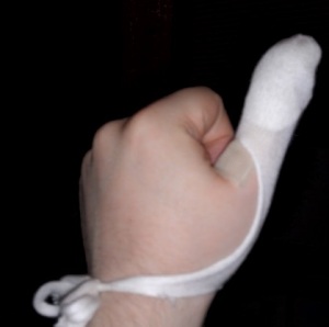Patching my thumb with gauze